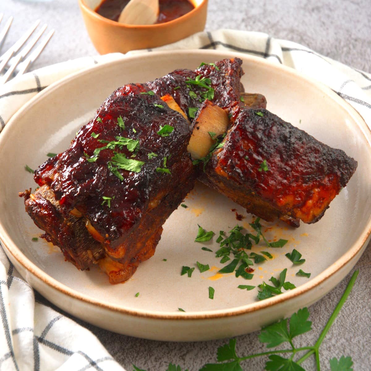 BBQ bison short ribs on plate.