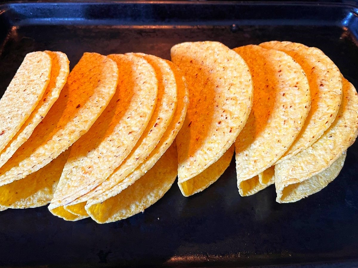 Hard taco shells on pan.