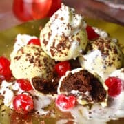 Black Forest cake balls stacked on plate.