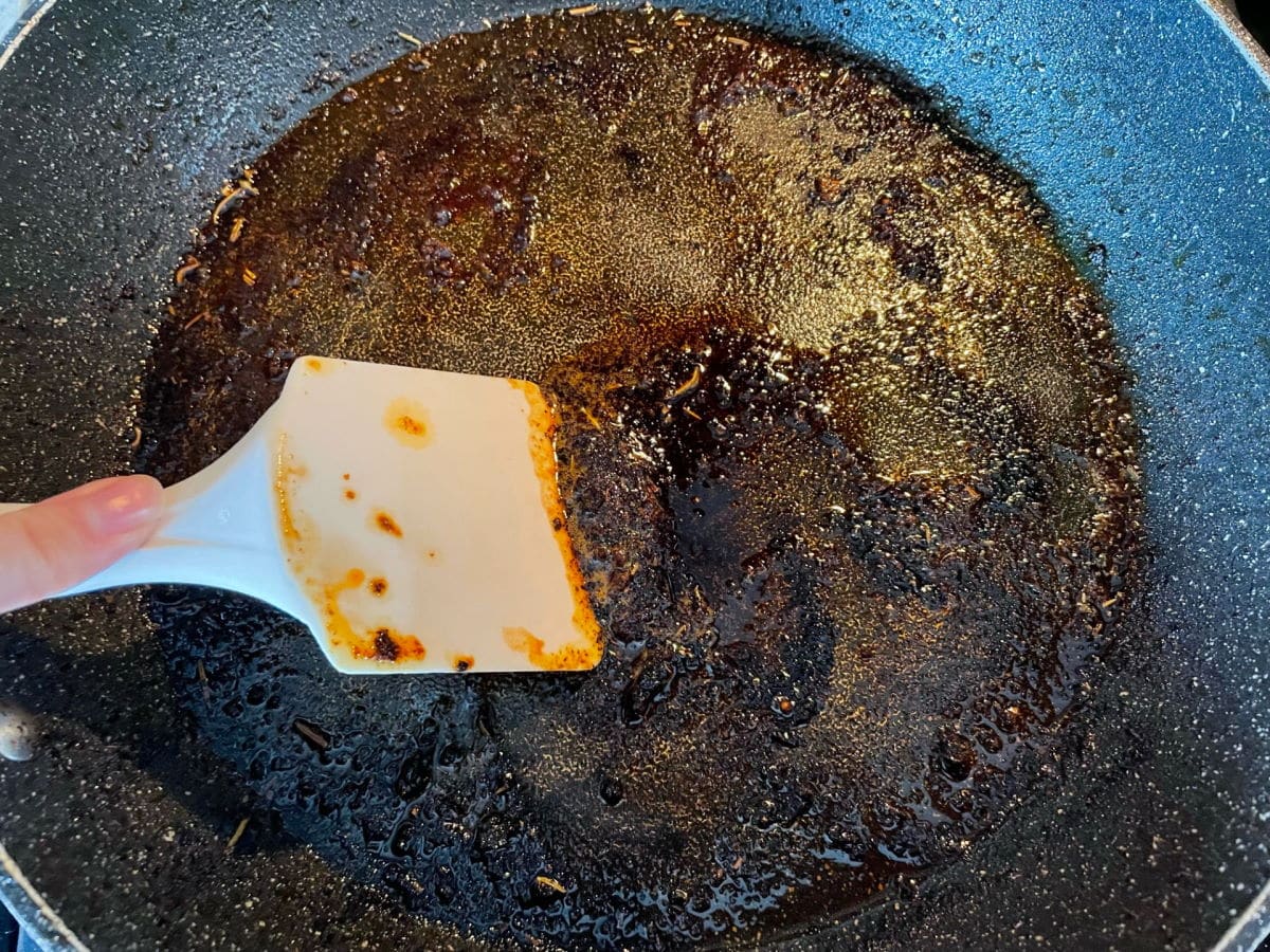 Dirty frying pan with spatula.