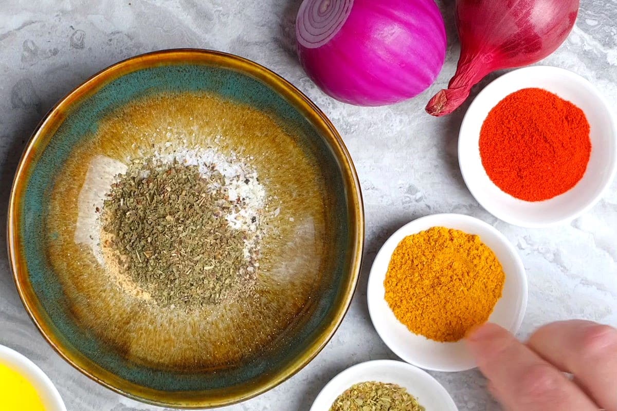 Blackening spices in separate small dishes.