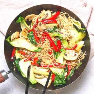 Bok choy stir fry in frying pan.