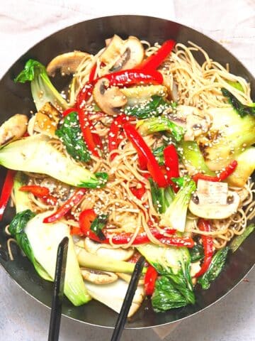 Bok choy stir fry in frying pan.
