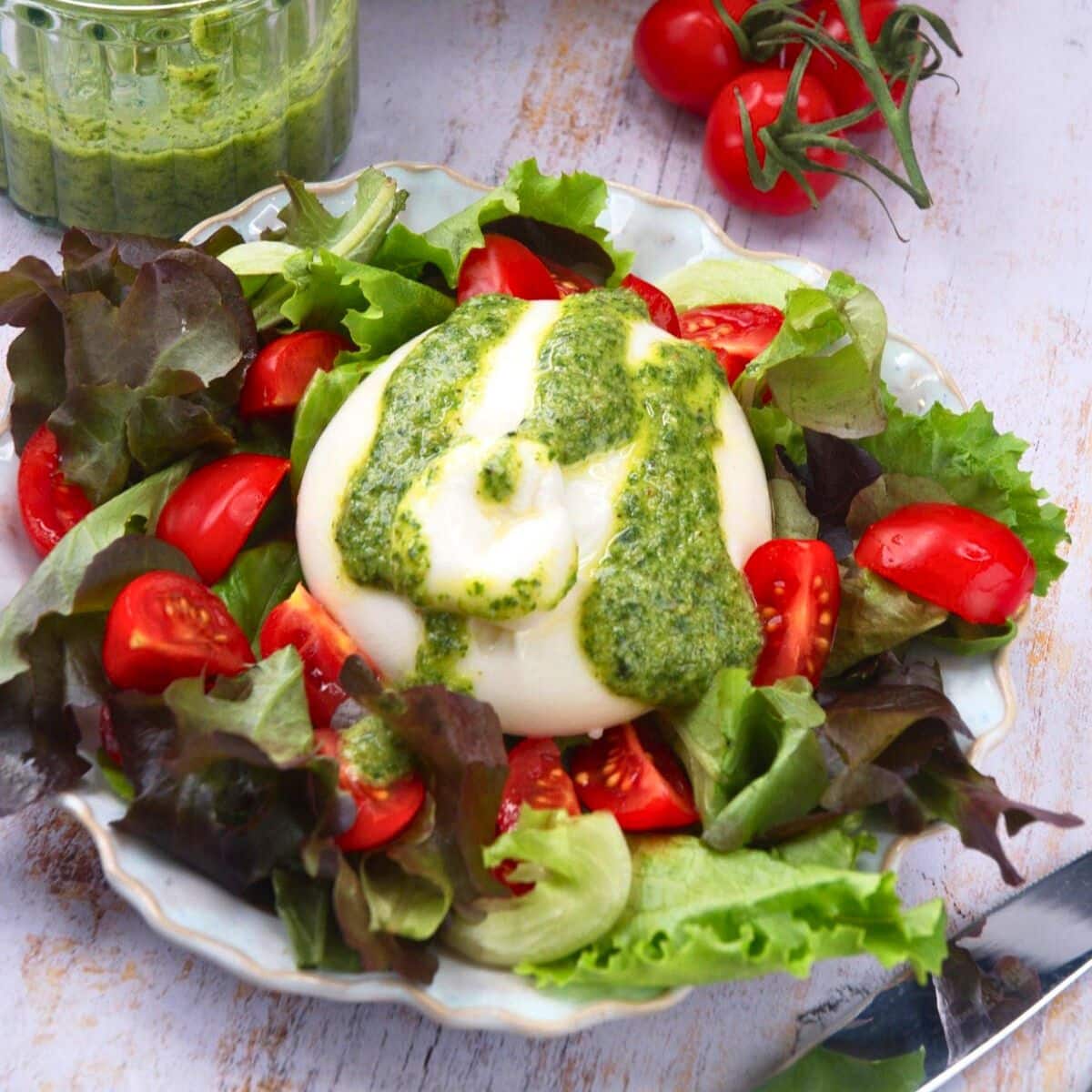 Burrata salad with pesto dressing.