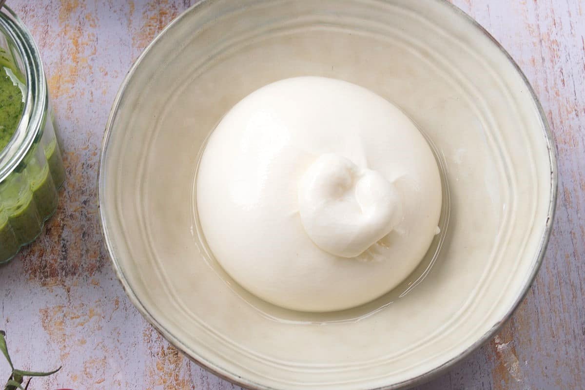 Burrata cheese on plate.