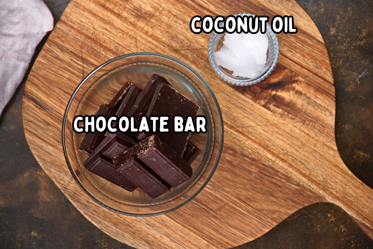 Chocolate cake pop coating ingredients prepped and labeled on wooden board.