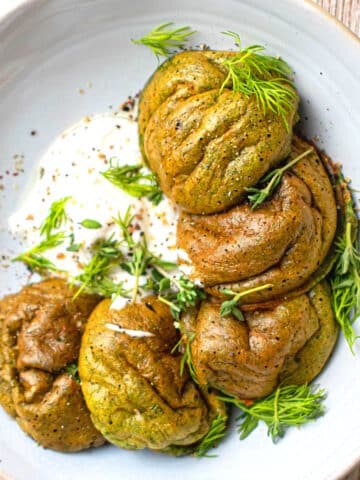 Spinach egg bites on plate with Greek yogurt.