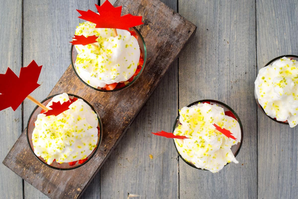 Canada Day three milk cake in jars with whipped topping.