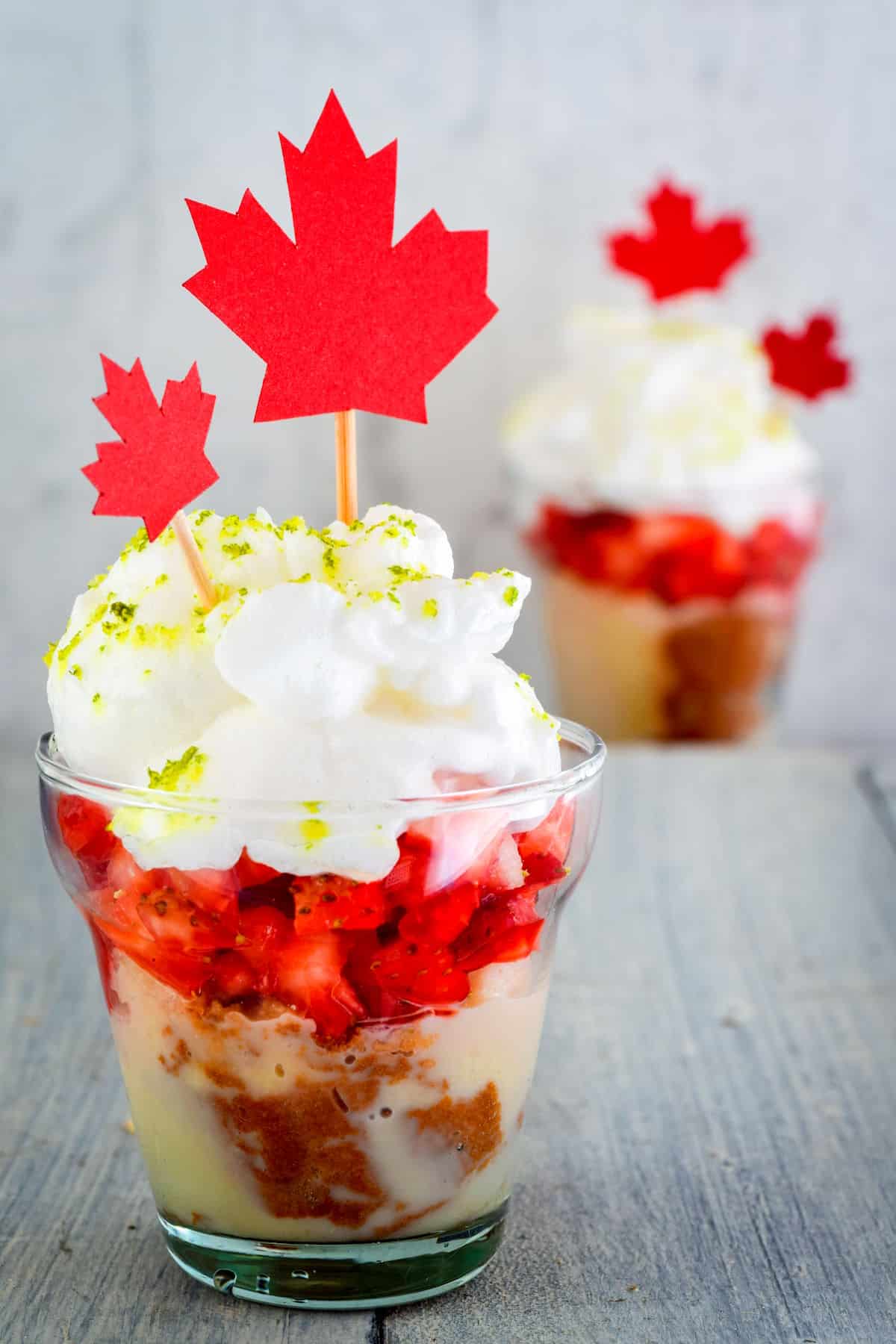 Canada Day cake in a jar with maple leaf decorations.