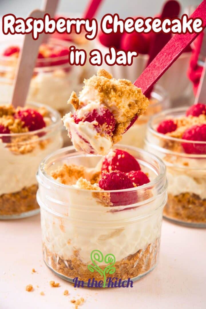 No bake cheesecake in jars with spoons and text overlay that says 'raspberry cheesecake in a jar'.