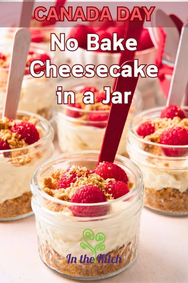 Raspberry cheesecake in jars with red and white spoons and text overlay that says 'Canada Day no bake cheesecake in a jar'.