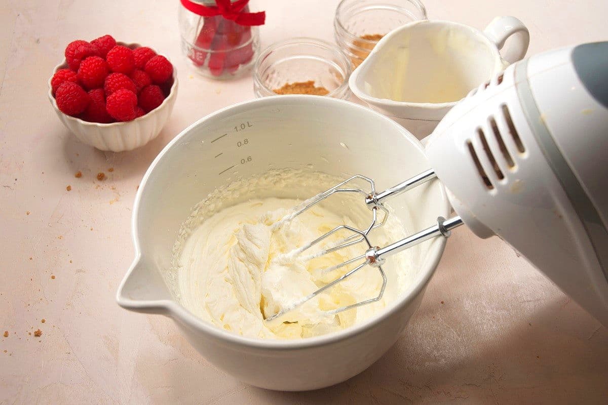 Heavy whipping cream whipped in bowl.