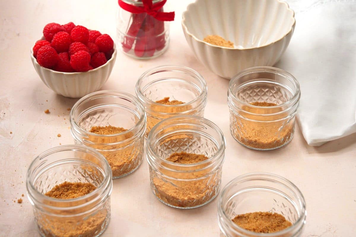 Graham cracker crumb crust in small jars.