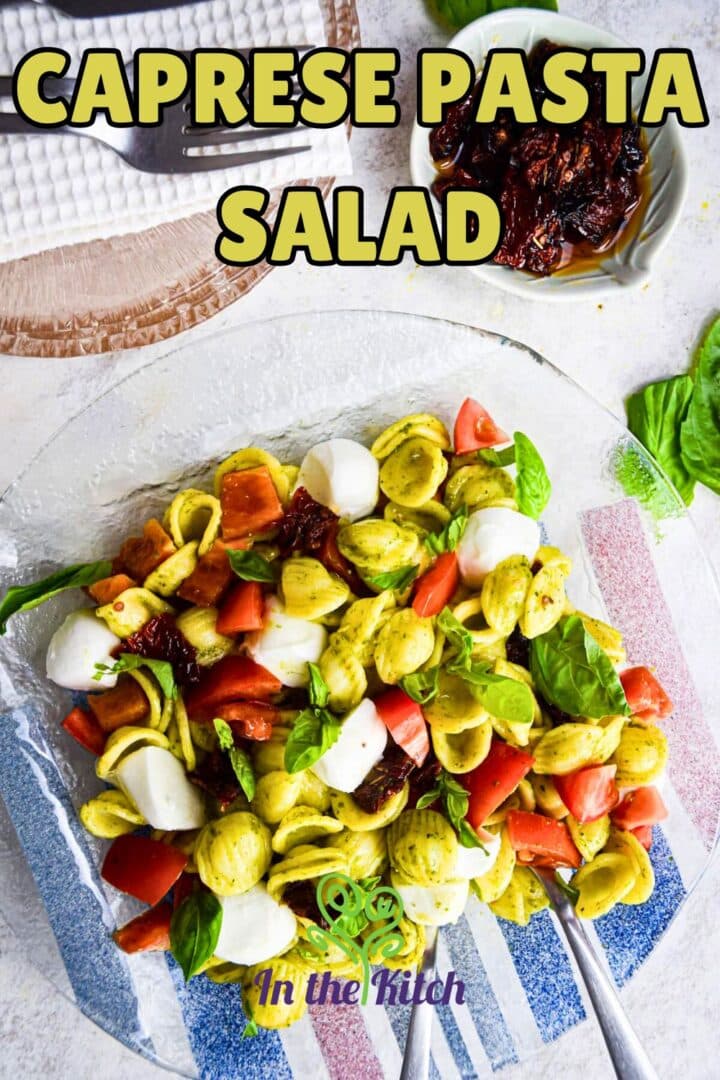 Caprese pasta salad on clear plate with text overlay that says 'caprese pasta salad'.
