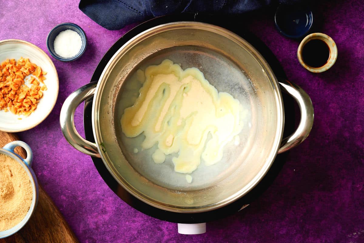 Milk powder and water in pot.