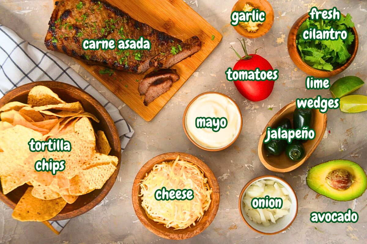 Carne asada nachos ingredients prepped and labeled.