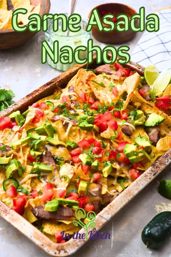 Carne asada nachos on sheet pan with text overlay that says 'carne asada nachos'.