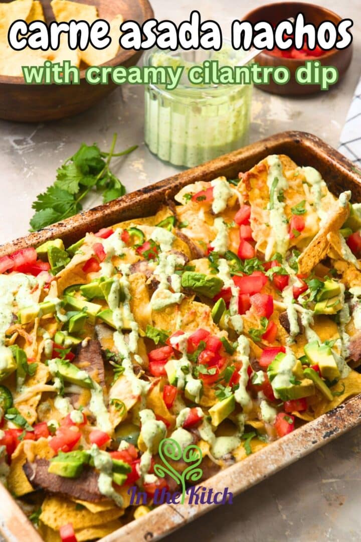 Carne asada nachos on sheet pan with text overlay that says 'carne asada nachos with creamy cilantro dip'.
