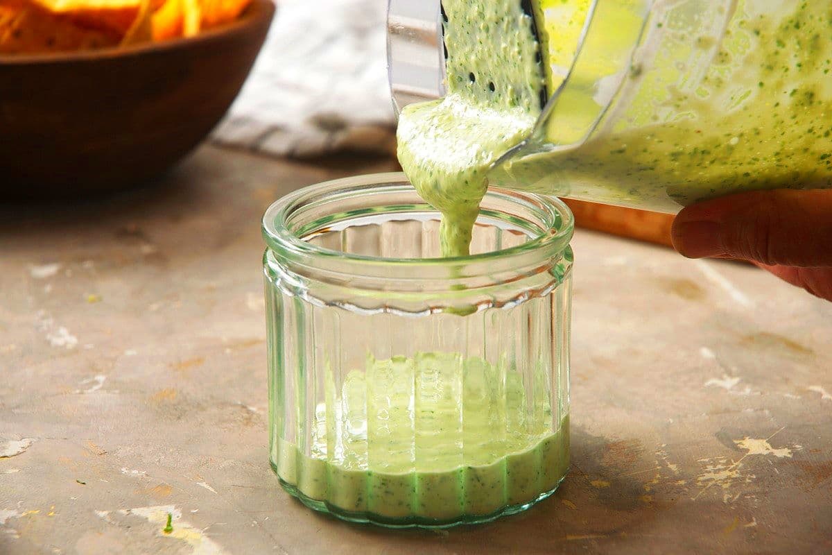 Creamy cilantro dip in jar.