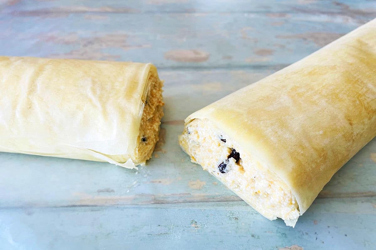 Cheese strudel filling rolled up into logs with phyllo dough.