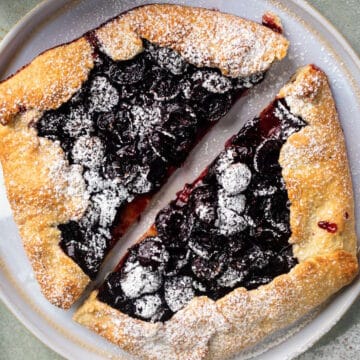 Cherry galette dusted with icing sugar.