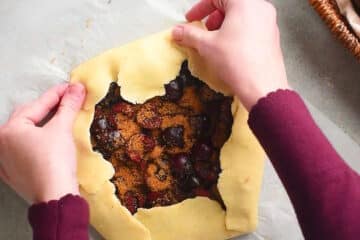 Pastry dough folded over cherry mixture.