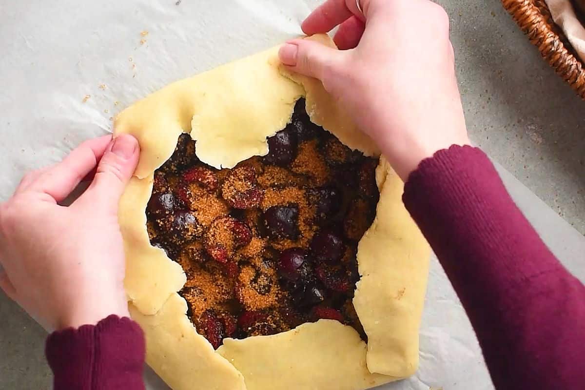 Pastry dough folded over cherry mixture.