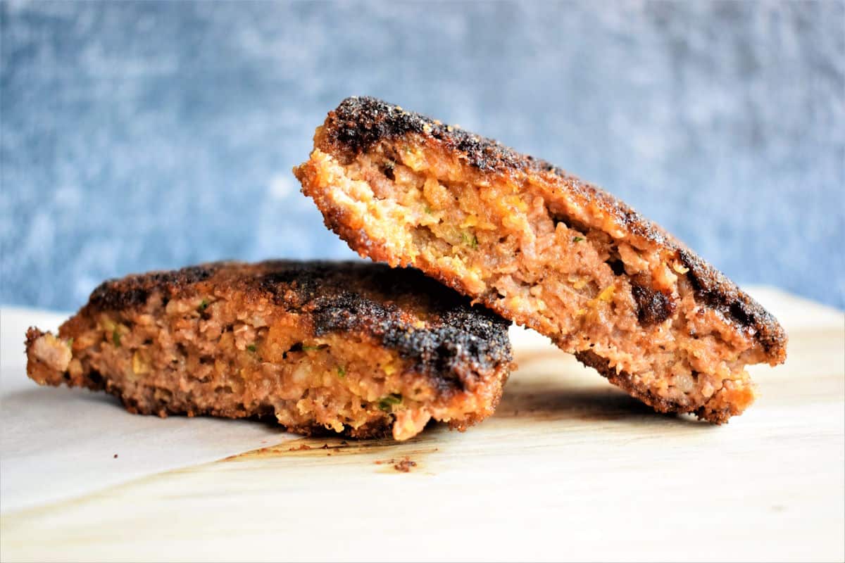 Chicken fried burger patty cut open.