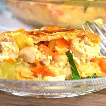 Chicken pasty pie in baking dish and on small clear glass plate.