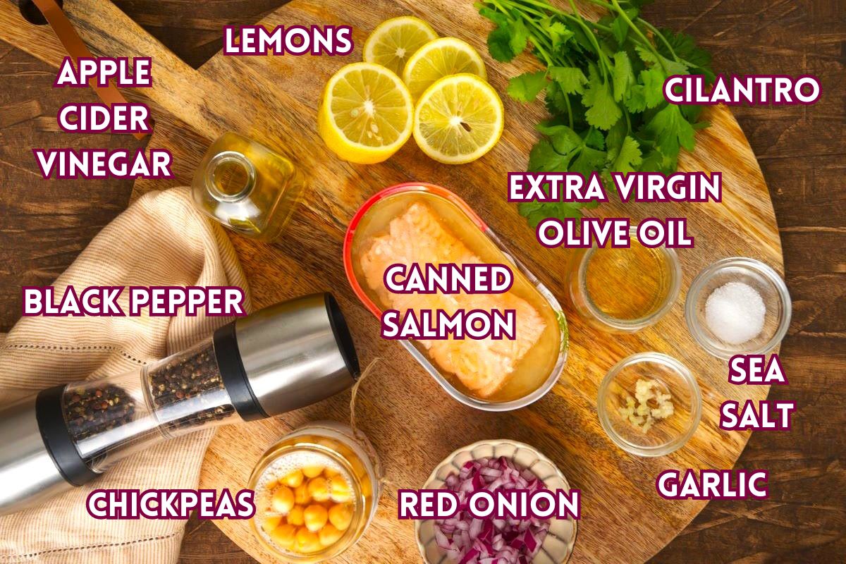 Chickpea salmon salad ingredients prepped on wooden board.