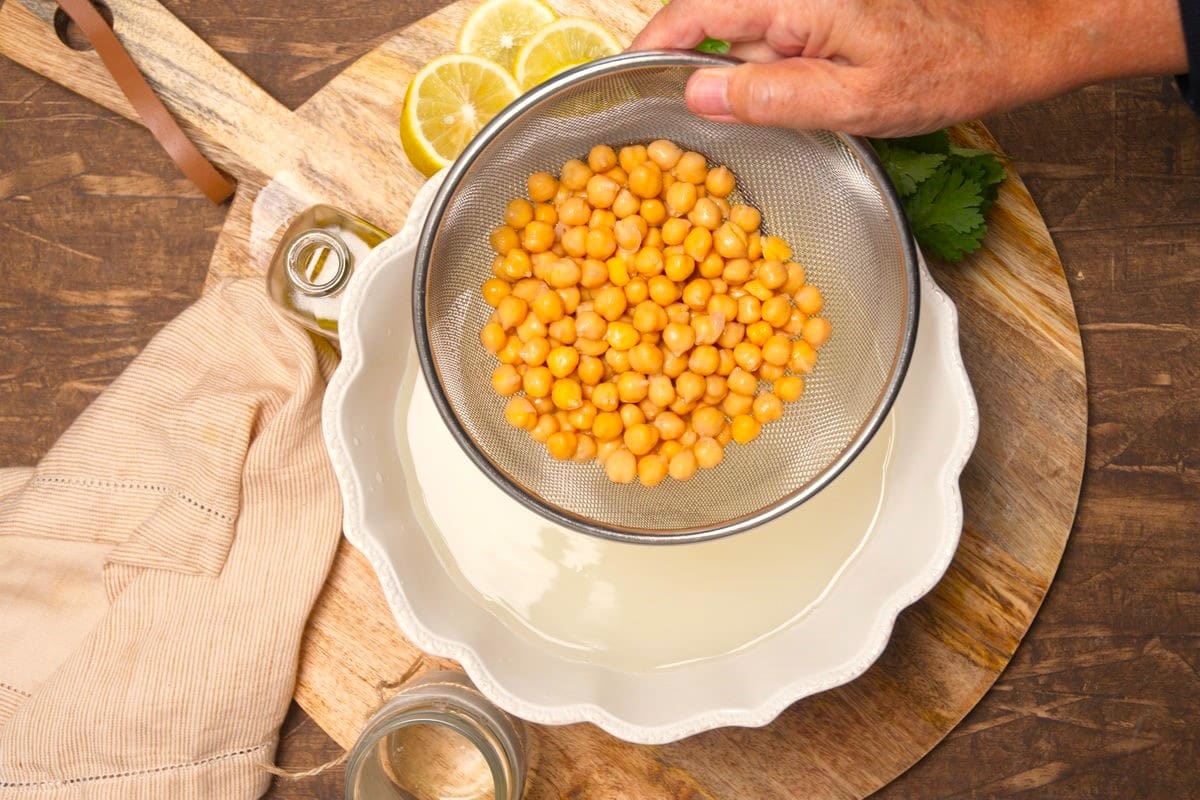 Chickpeas in mesh strainer.