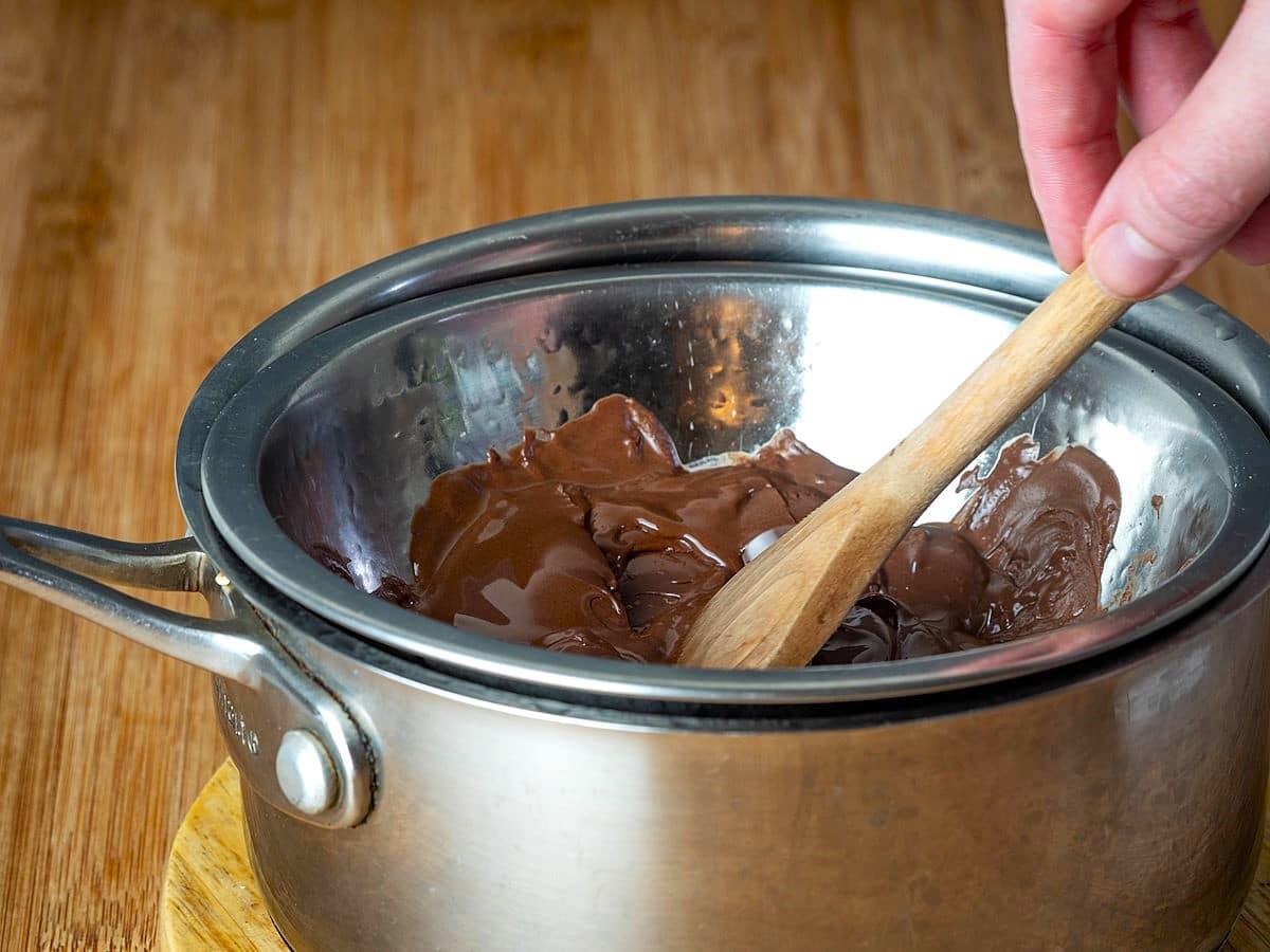 Chocolate melting in metal bowl.