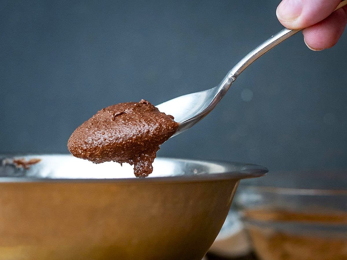 Chocolate truffle mixture on spoon.