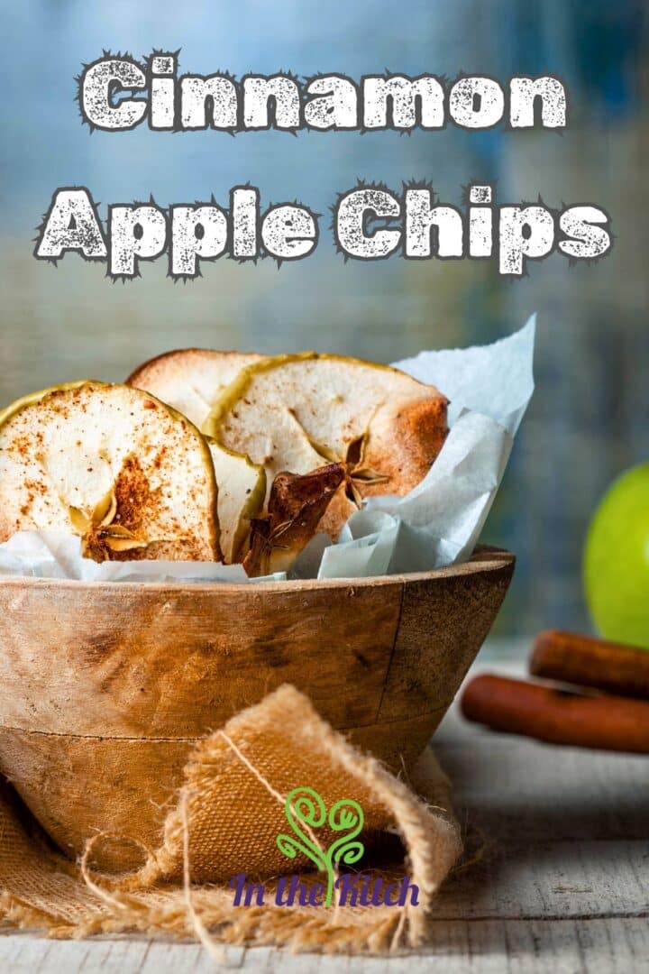 Cinnamon apple chips in a wooden bowl with text overlay that says 'cinnamon apple chips'.