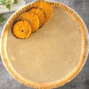 Clear pumpkin pie with dehydrated orange slices.