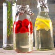Cocktail syrups infusing in bottles.