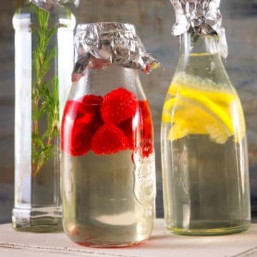 Cocktail syrups infusing in bottles.