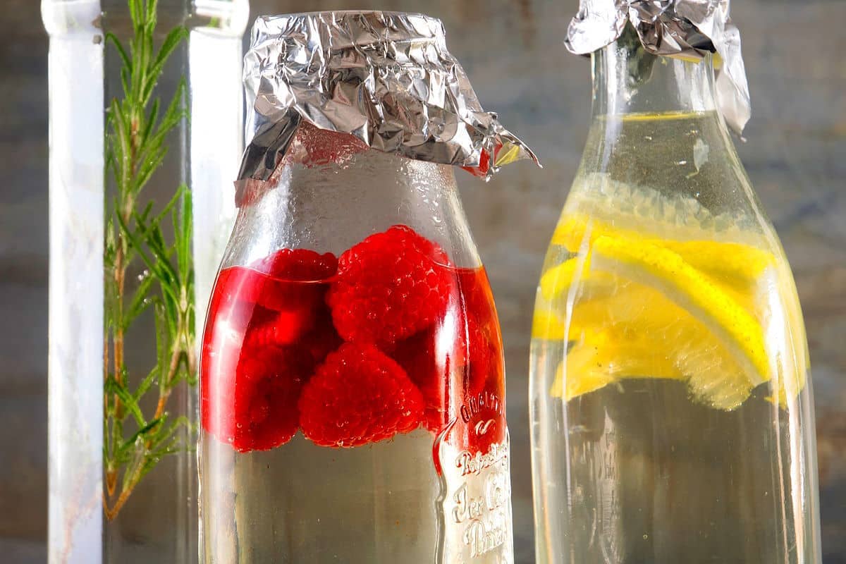 Cocktail infusing syrups in bottles.