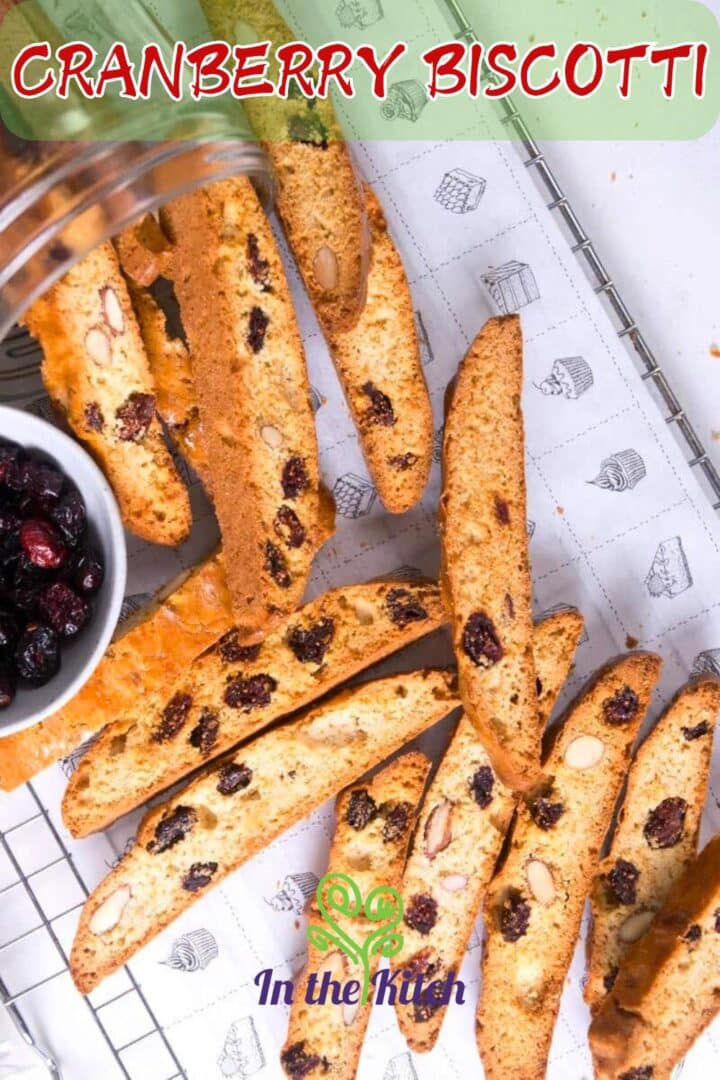 Cranberry biscotti on baking paper with text overlay that says 'cranberry biscotti'.