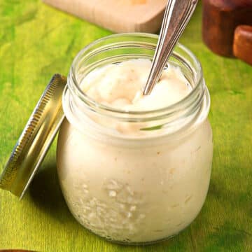 Lime sauce in jar with spoon.