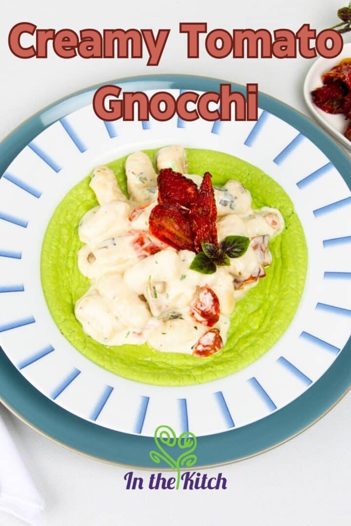 Creamy tomato gnocchi in bowl with pea purée and text overlay that says 'creamy tomato gnocchi'.