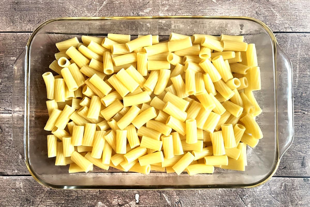 Short cut pasta in casserole dish.