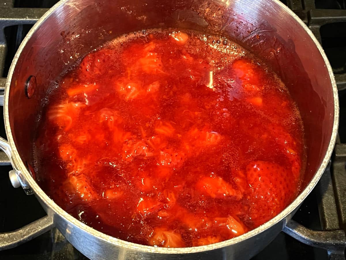 Strawberry compote in saucepan.