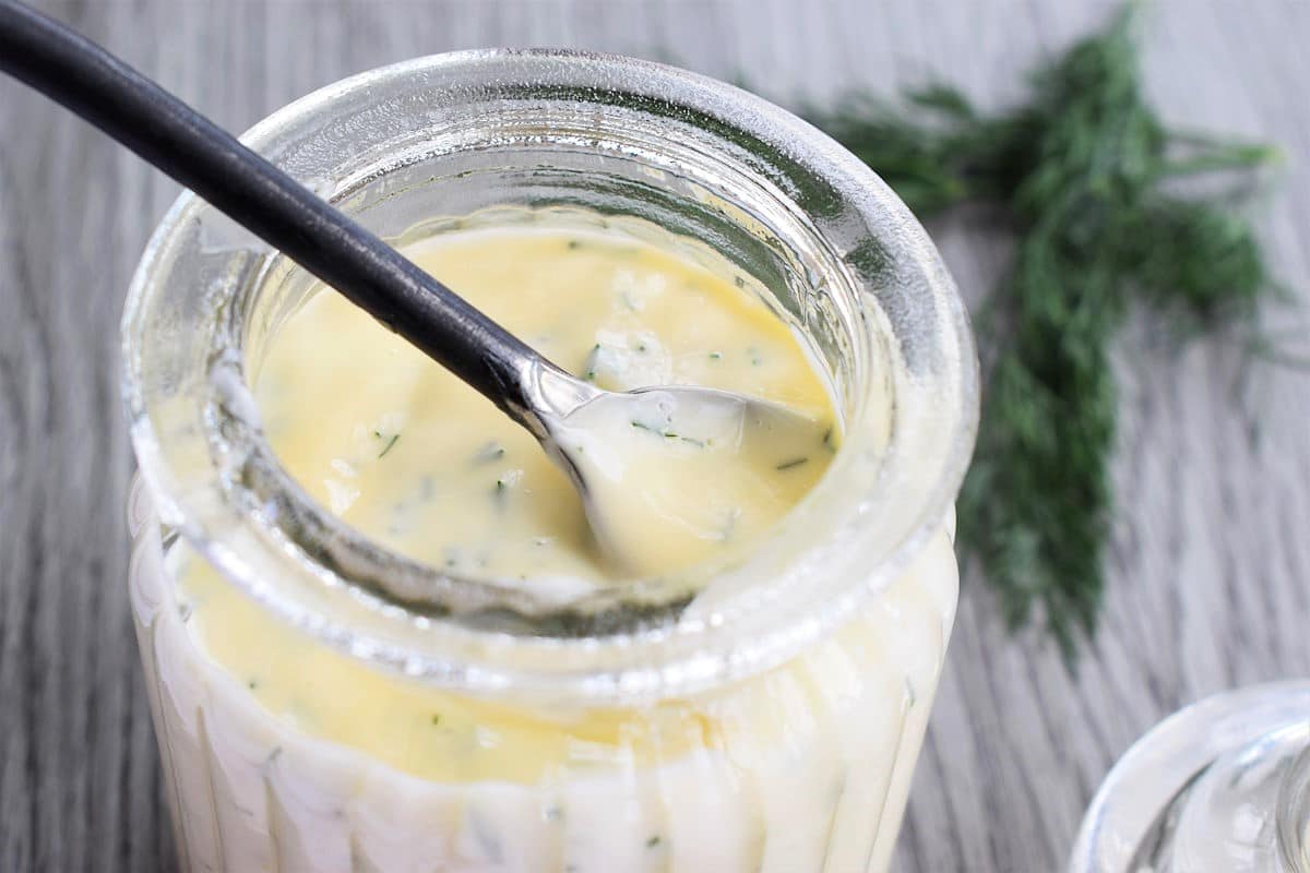 Honey dill sauce in small jar.
