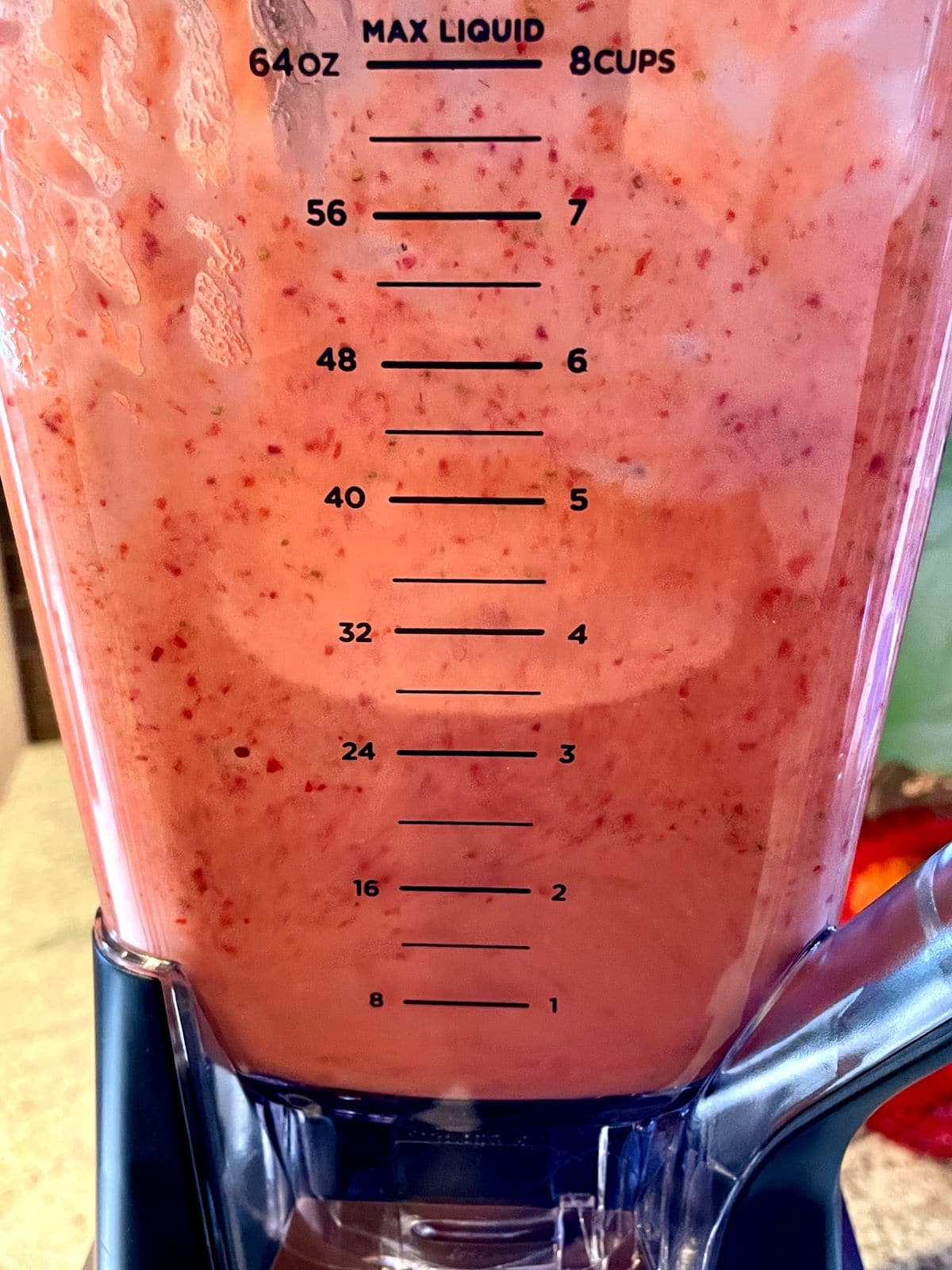 Strawberry vinaigrette ingredients blending in blender.