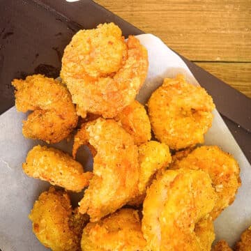 Coconut shrimp on parchment paper.