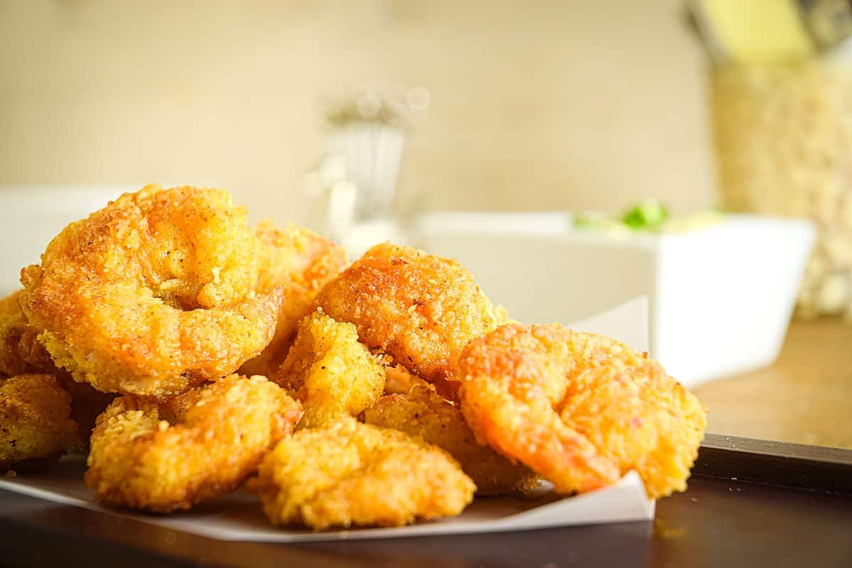 Breaded coconut shrimp on parchment.