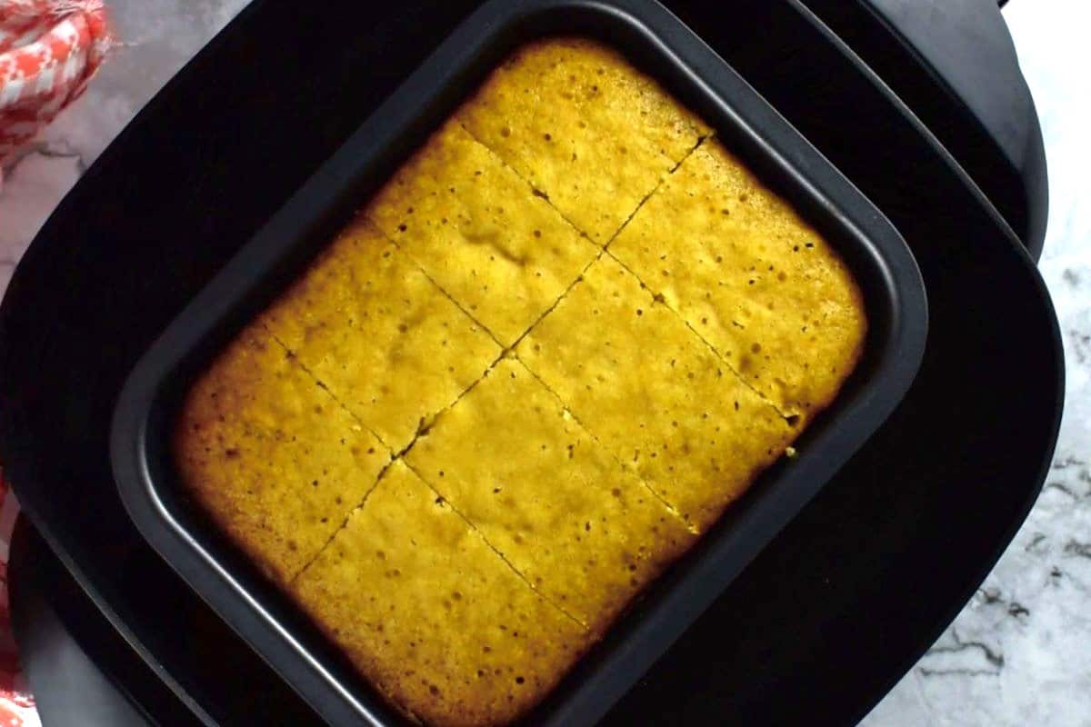 Cornbread in pan in electric skillet.