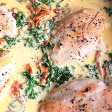 Creamy Tuscan chicken breast in skillet.