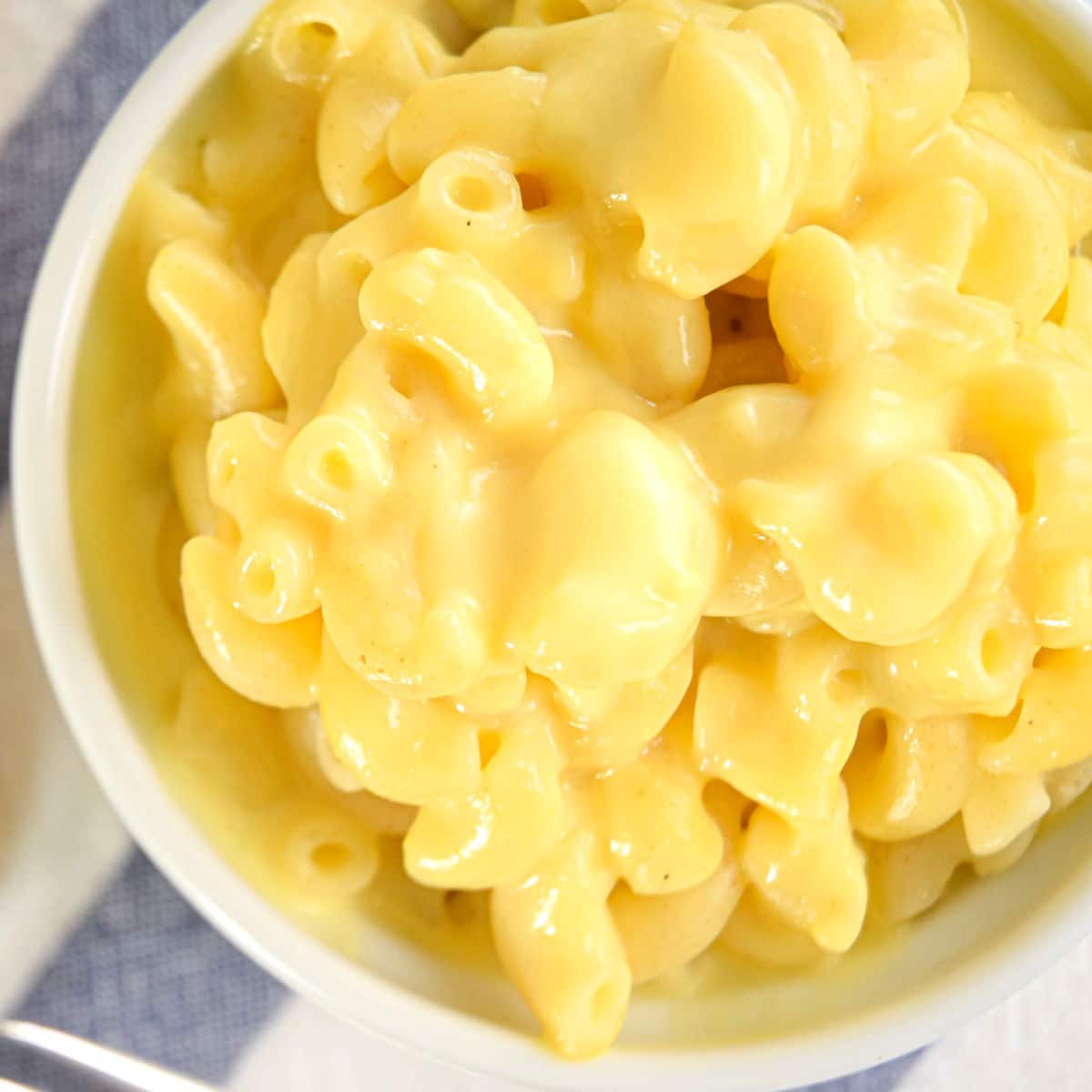 Creamy electric skillet mac and cheese in white dish.